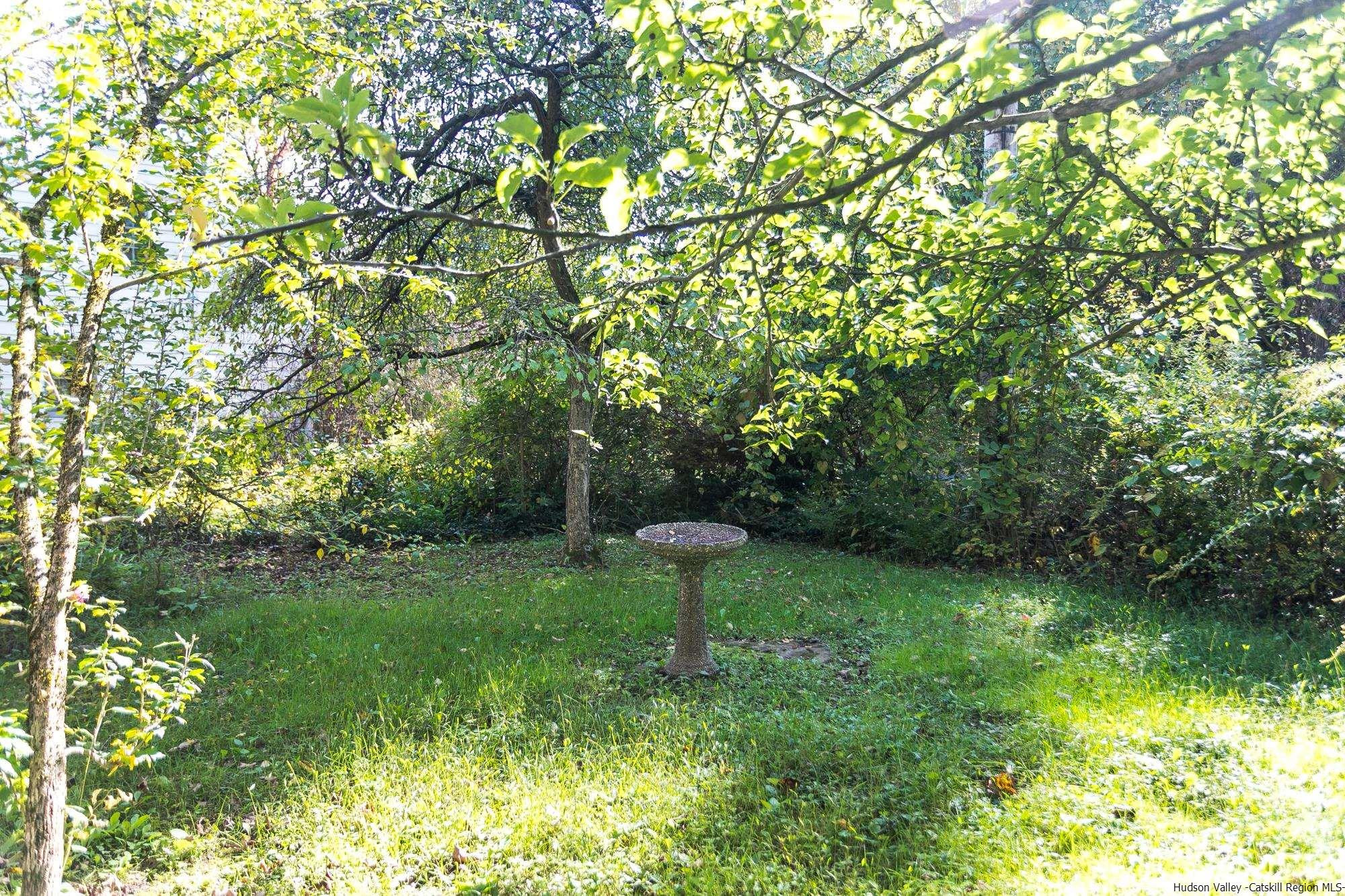 169 Marcott Road Kingston, NY 12401 - Photo 31 of 32 a view of a garden with a fountain