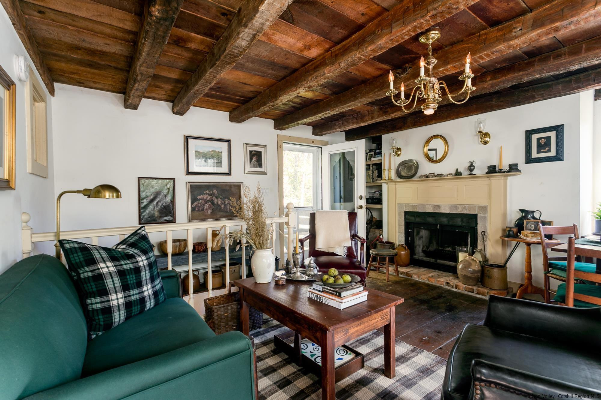169 Marcott Road Kingston, NY 12401 - Photo 7 of 32 a living room with furniture and a fireplace