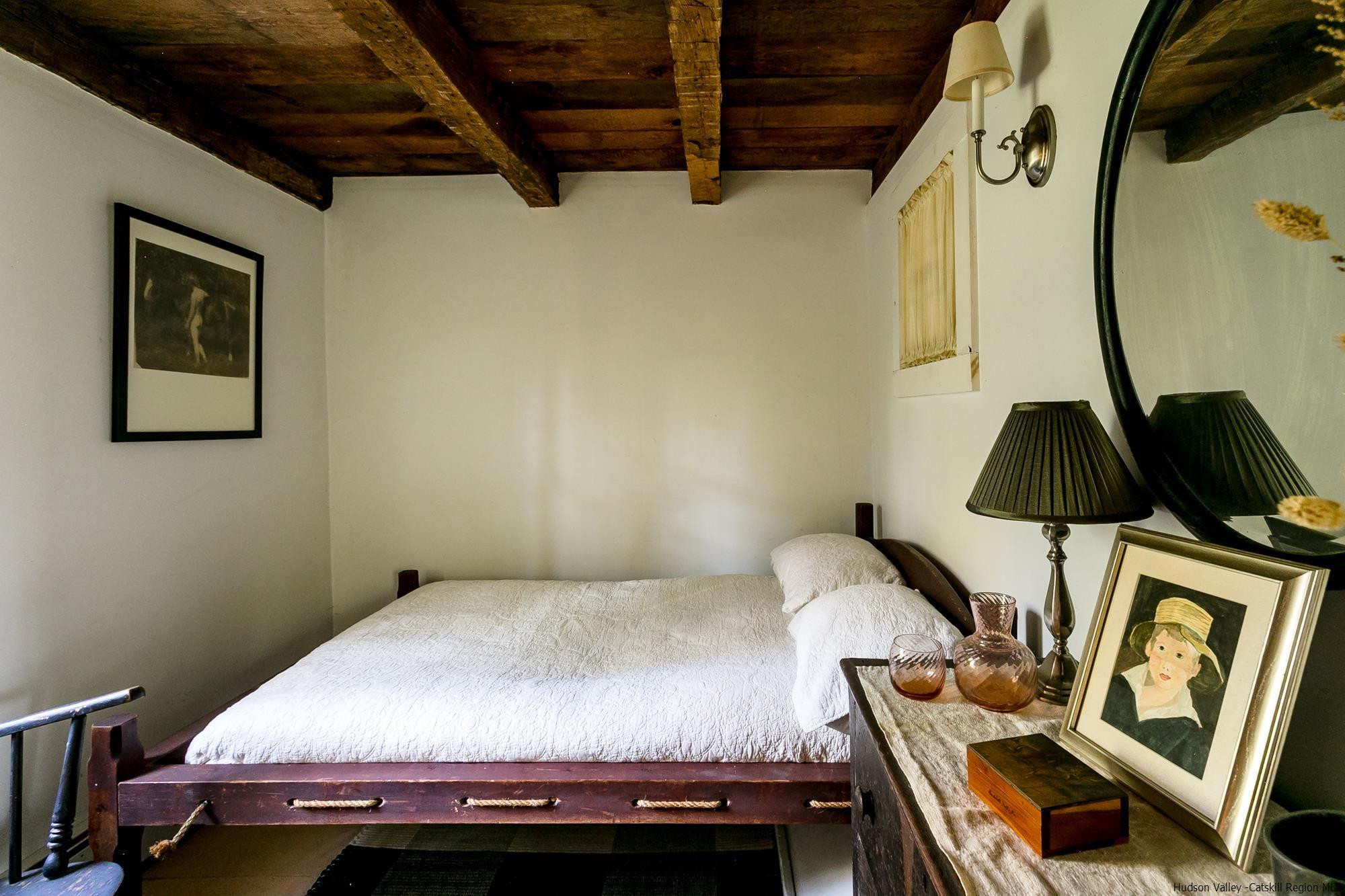 169 Marcott Road Kingston, NY 12401 - Photo 9 of 32 a bedroom with a bed and a chair