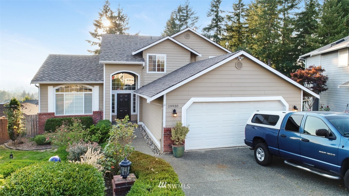 a front view of a house with parking space