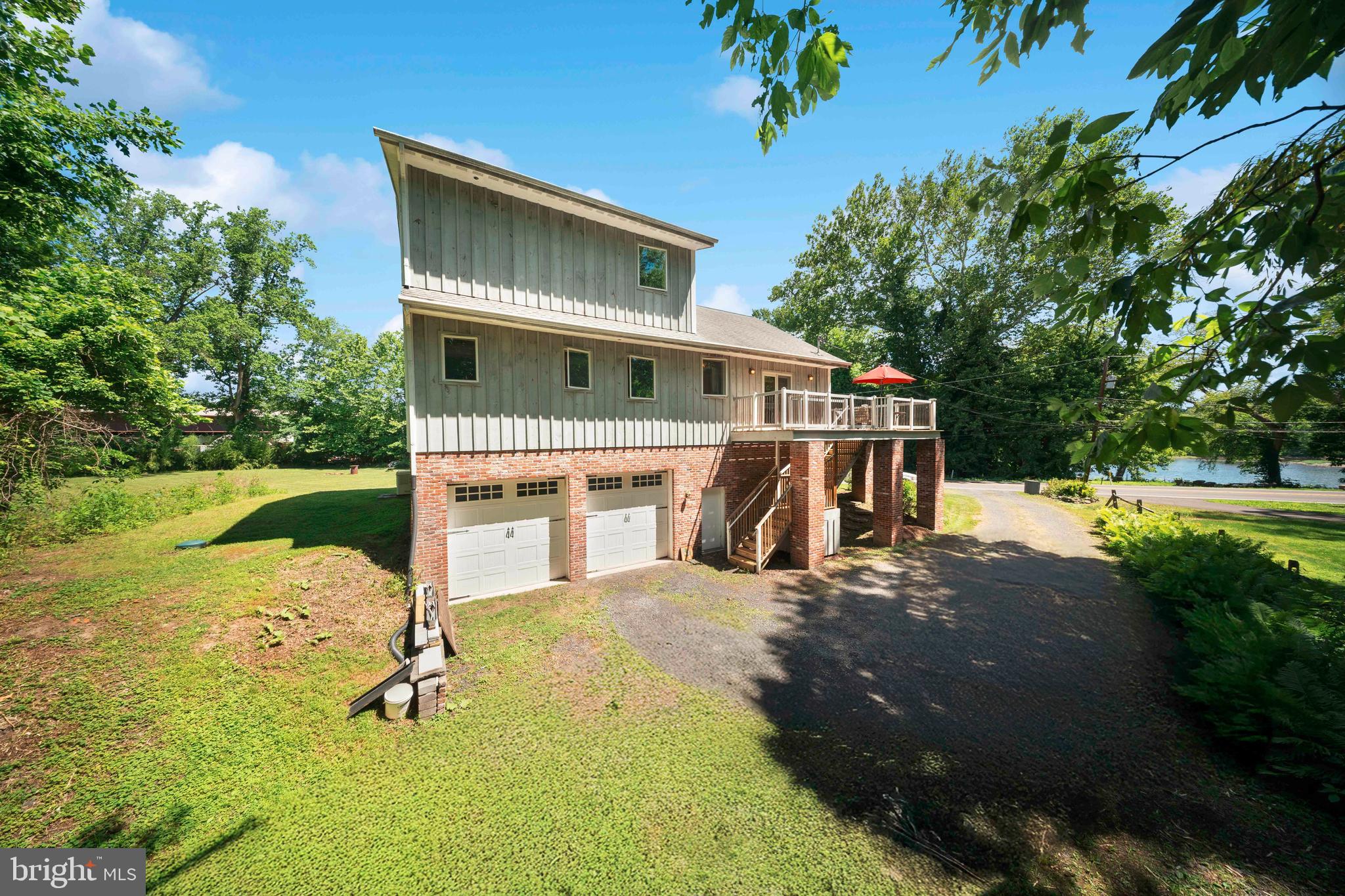 1473 North River Road Yardley, PA 19067 - Photo 4 of 42 a house with trees in the background