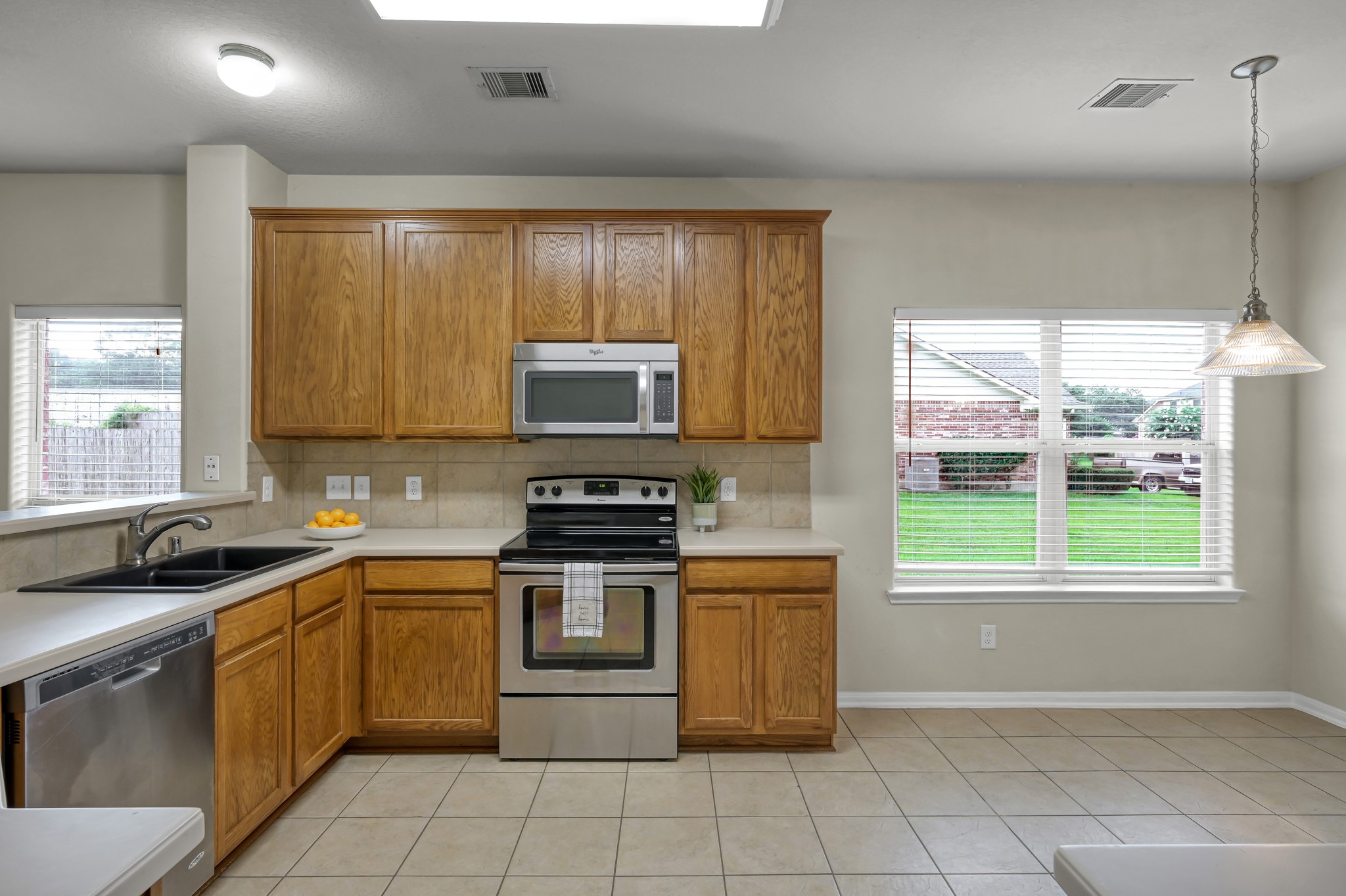 631 Timberstand Lane Spring, TX 77373 - Photo 14 of 38 The kitchen features 42" raised-panel cabinetry, Staron countertops, and plenty of storage for everyday convenience.