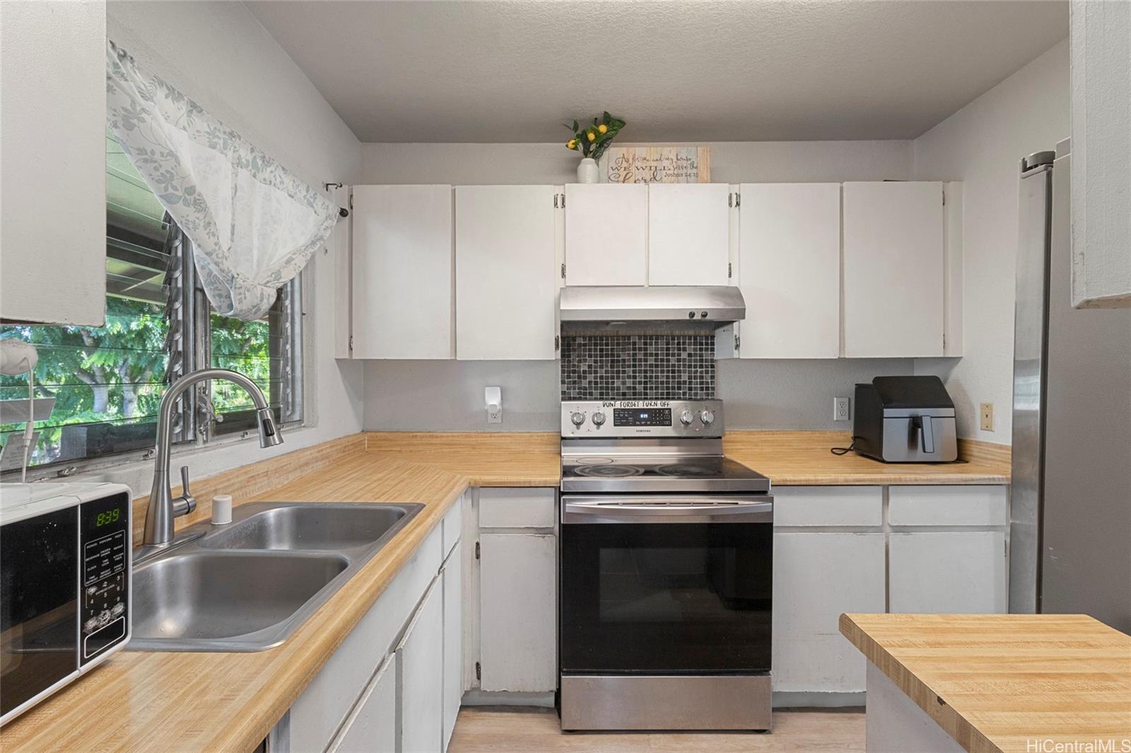 a kitchen with a stove and a sink