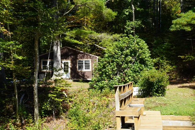 a backyard of a house with lots of green space