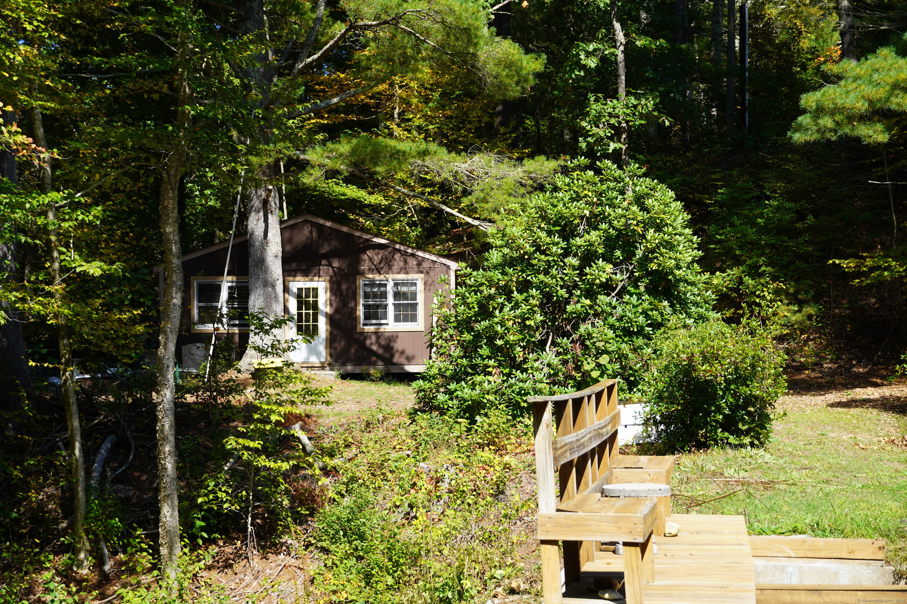 a backyard of a house with lots of green space