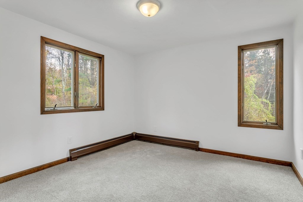 145 Chester Road Blandford, MA 01008 - Photo 18 of 34 a view of an empty room with a window