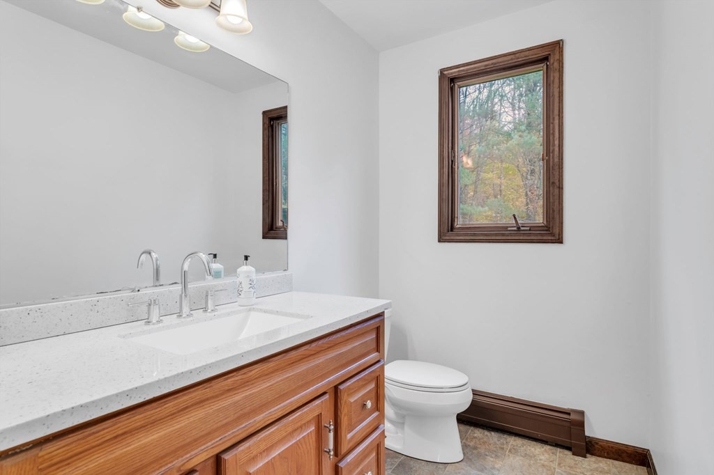 145 Chester Road Blandford, MA 01008 - Photo 20 of 34 a bathroom with a toilet a sink and mirror