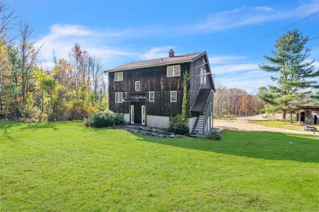 145 Chester Road Blandford, MA 01008 - Photo 3 of 34 a view of a house with backyard and garden