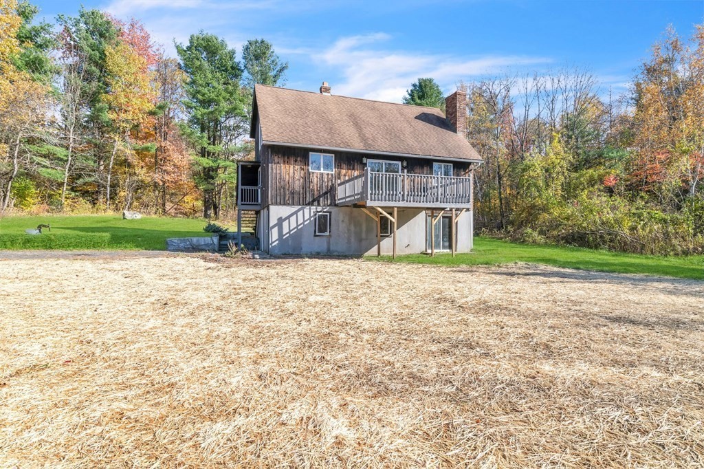145 Chester Road Blandford, MA 01008 - Photo 6 of 34 a view of a house with a yard and large tree