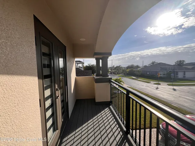 a view of a balcony with furniture