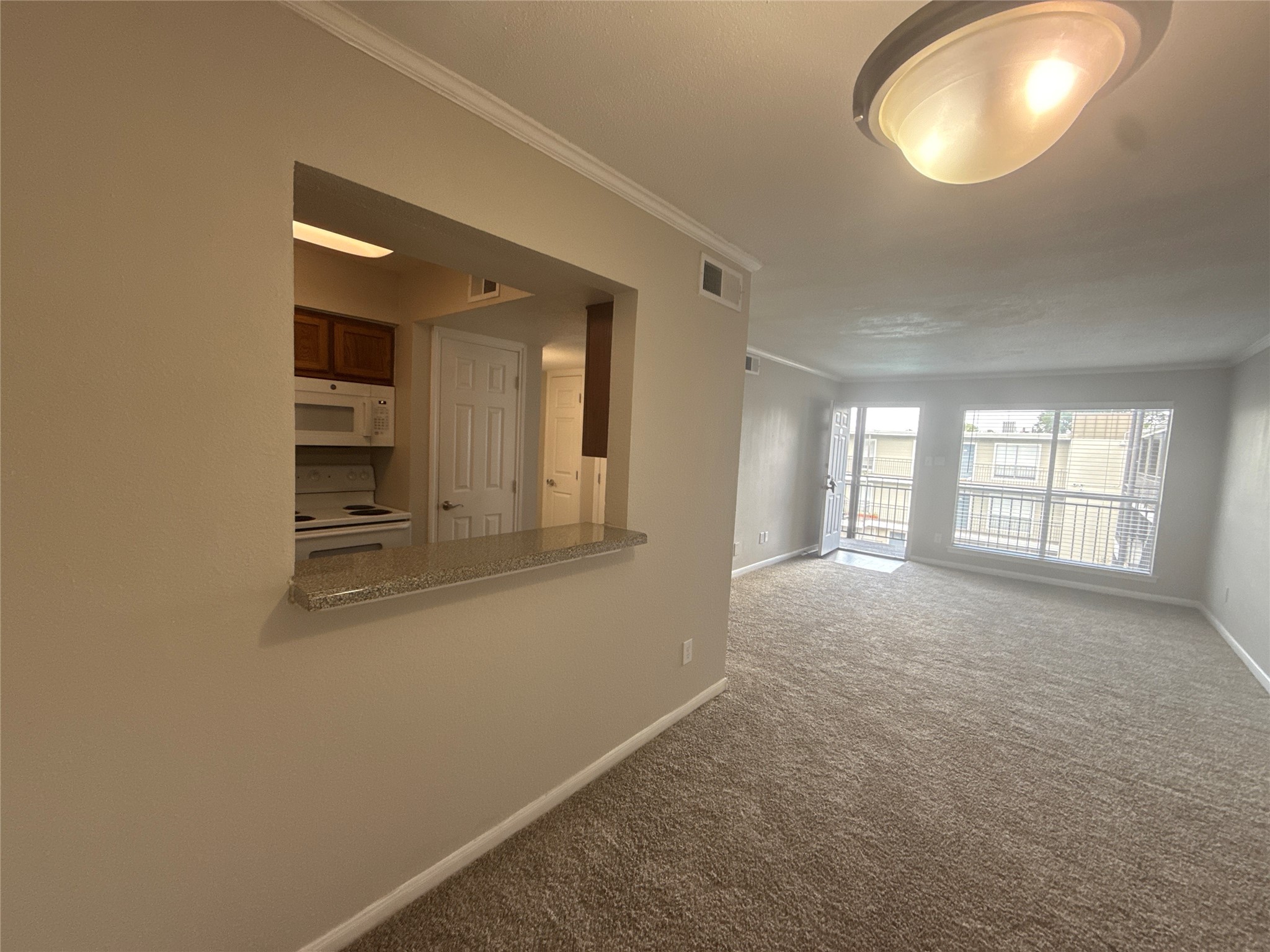 7315 Brompton Road, Unit 315B Houston, TX 77025 - Photo 5 of 13 wooden floor in an empty room with a window