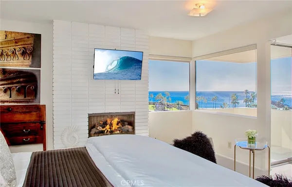 a bedroom with a bed and a fireplace