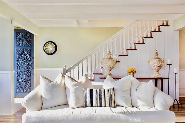 a living room with furniture and a clock