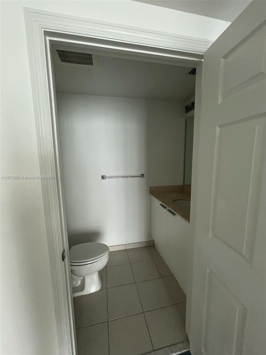 140 South Dixie Highway, Unit 816 Hollywood, FL 33020 - Photo 8 of 9 a bathroom with a toilet and a shower