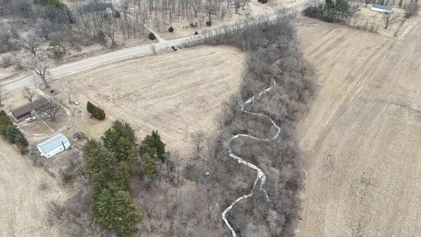 a view of a backyard of the house
