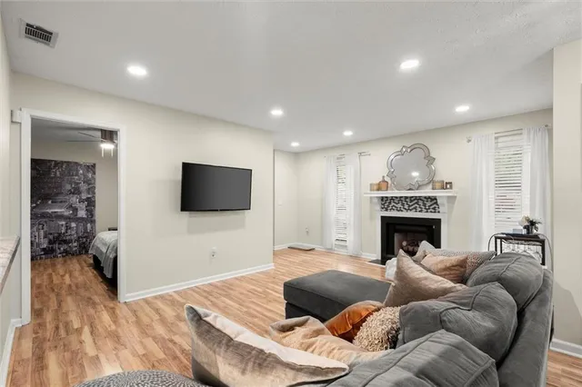 a bedroom with a bed and a chair