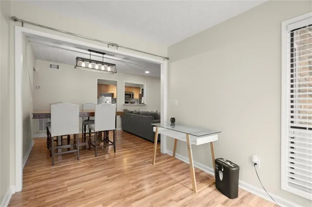 a kitchen with stainless steel appliances granite countertop a sink stove microwave and refrigerator