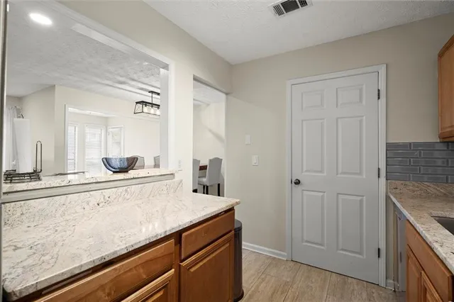 a kitchen with a stove and a microwave