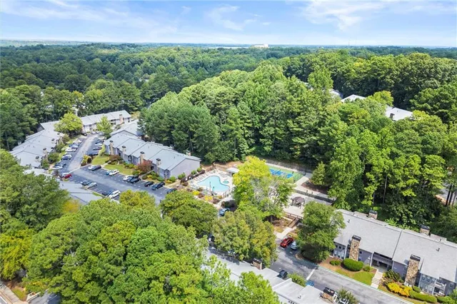 an aerial view of a house with a yard