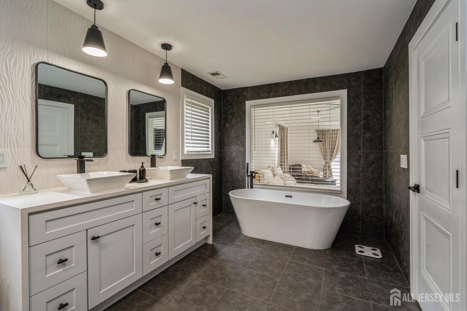 657 Case Road Branchburg, NJ 08853 - Photo 27 of 43 a spacious bathroom with a double vanity sink mirror and bathtub