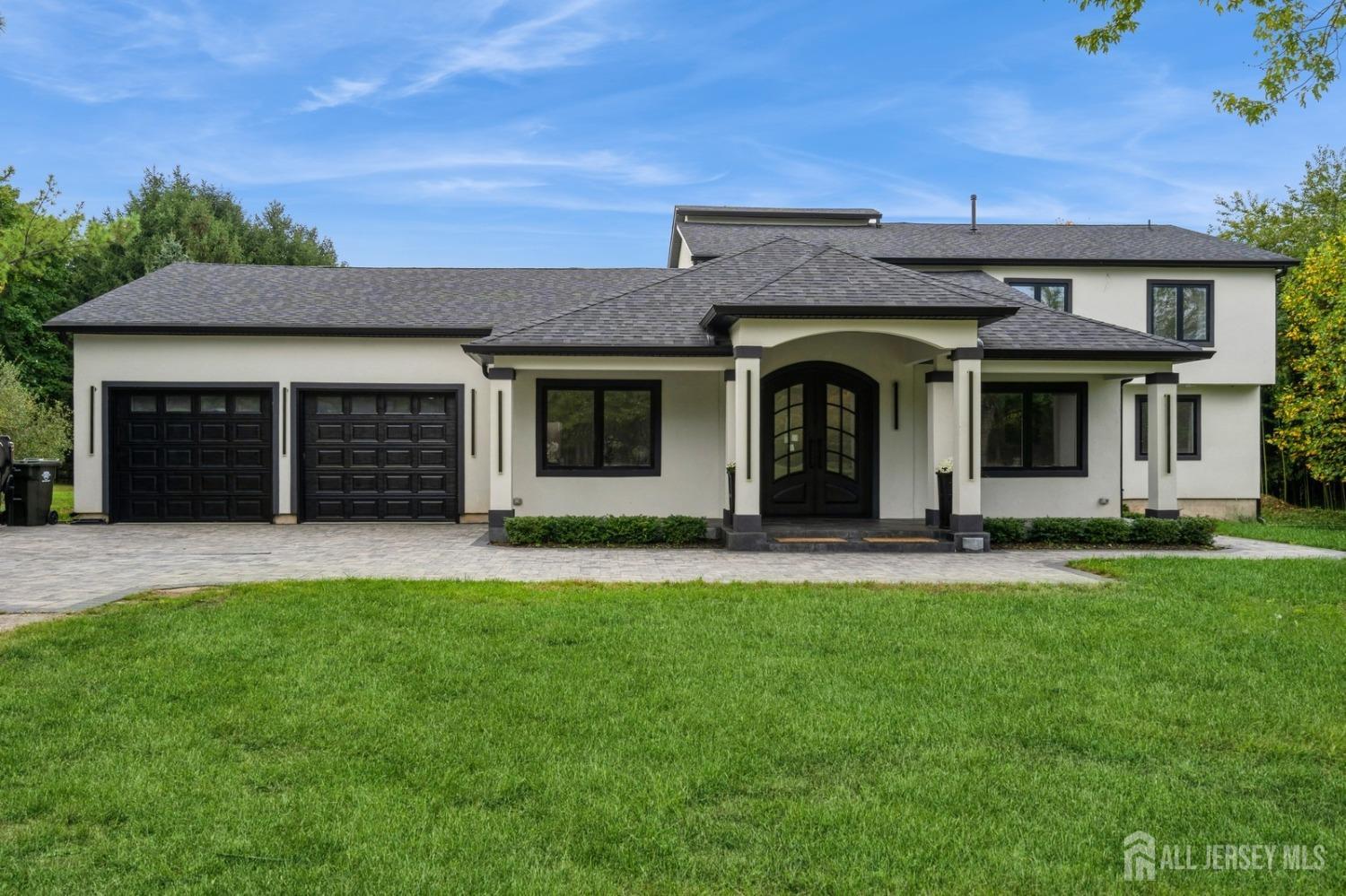 657 Case Road Branchburg, NJ 08853 - Photo 3 of 43 a front view of a house with a garden