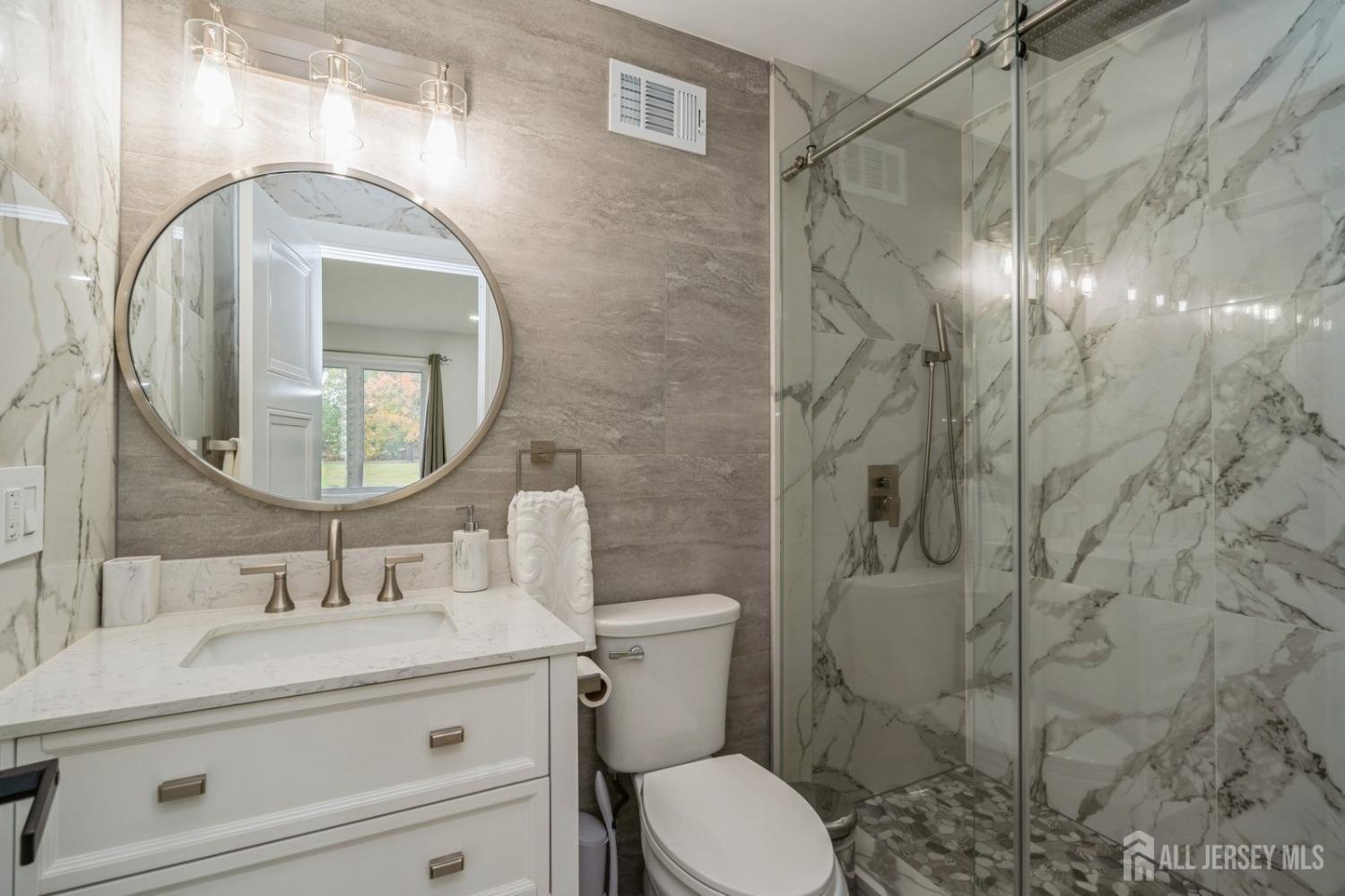 657 Case Road Branchburg, NJ 08853 - Photo 36 of 43 a bathroom with a sink toilet and a mirror