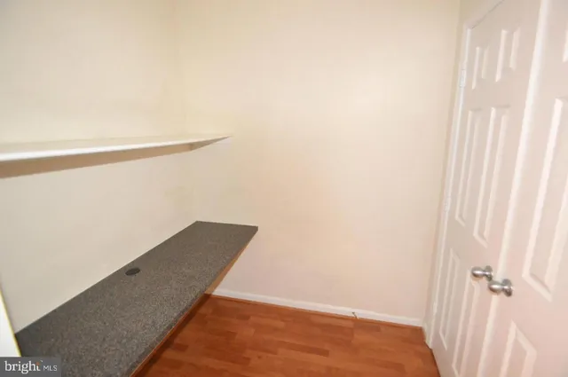 a view of wooden floor in an empty room