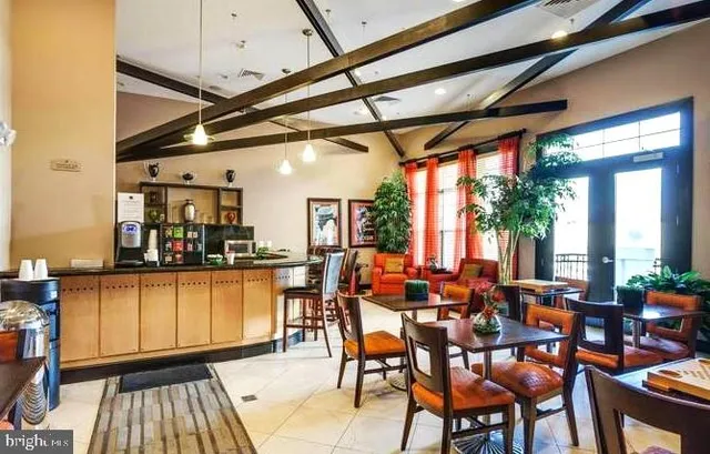 a group of people sitting at tables in a room