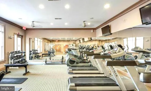 a view of a living room with gym equipment