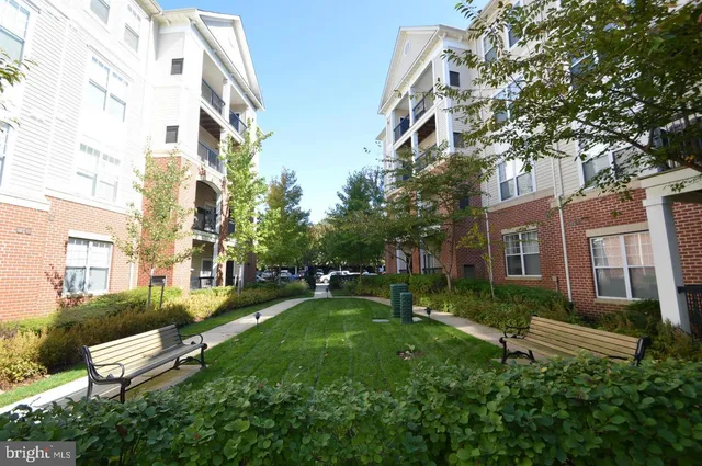 a view of a building with a yard