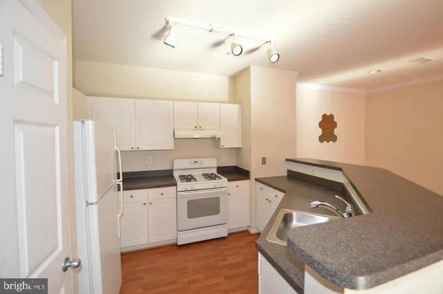 a kitchen with a stove and a sink