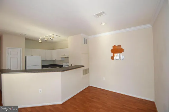 a kitchen with a sink a stove and cabinets