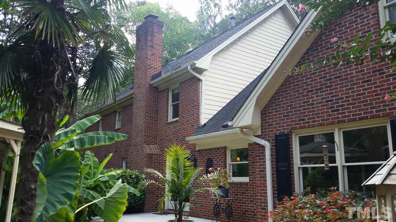 616 Misty Isle Place Raleigh, NC 27615 - Photo 22 of 25 a front view of a house with a garden