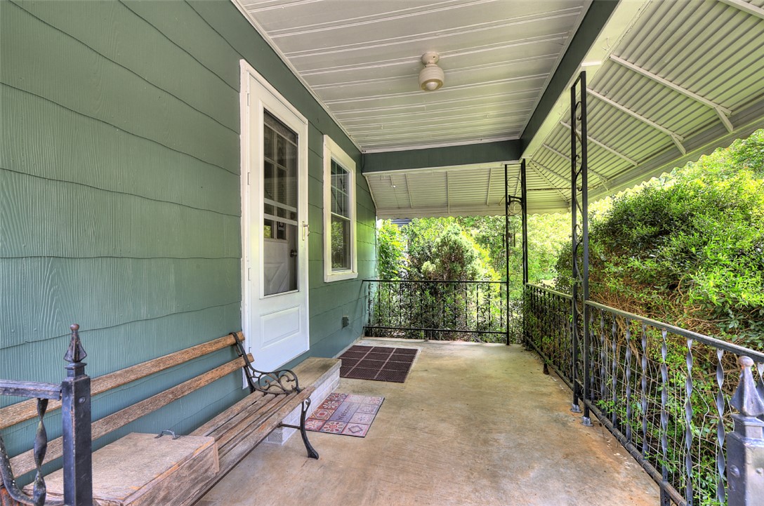5064 Keowee School Road Seneca, SC 29672 - Photo 6 of 49 Welcome to a charming covered porch, offering a serene outdoor retreat.