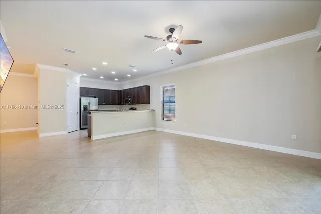 a view of a kitchen with a sink and wooden floor
