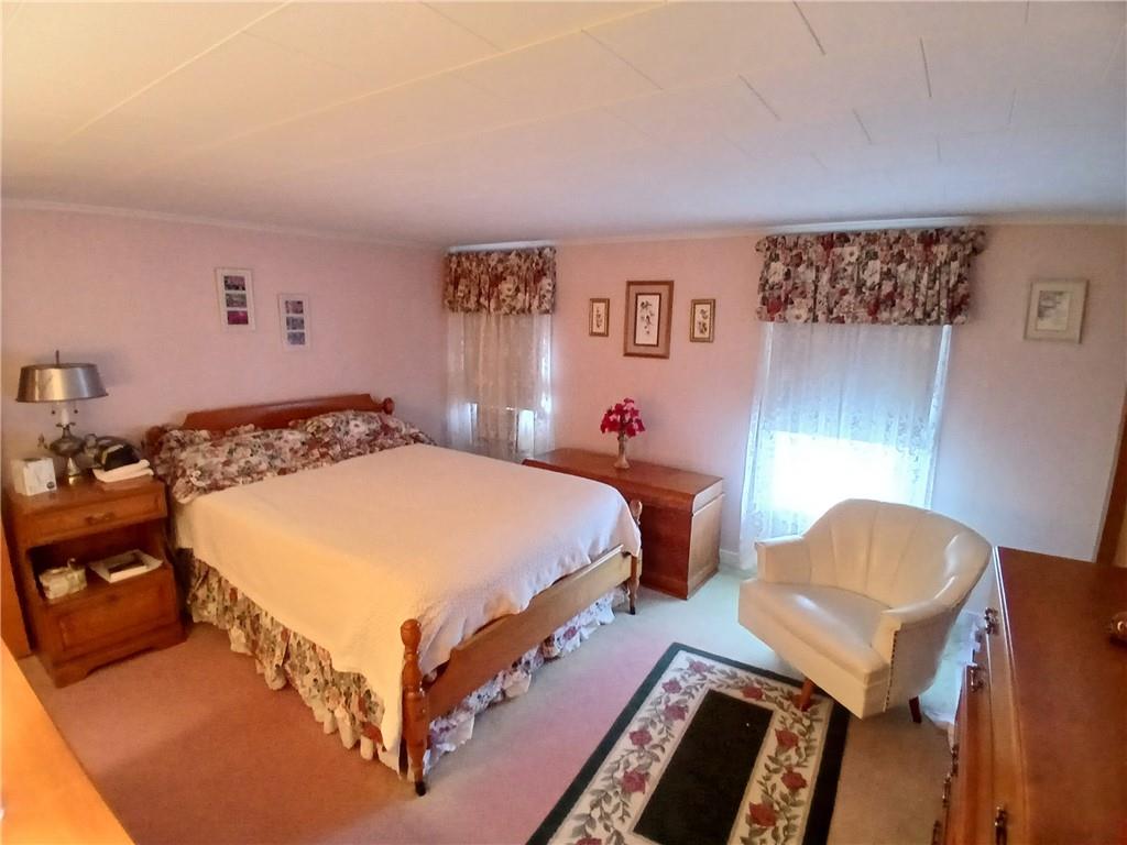186 Dutch Hill Road Latrobe, PA 15650 - Photo 17 of 29 a bedroom with a bed and chair
