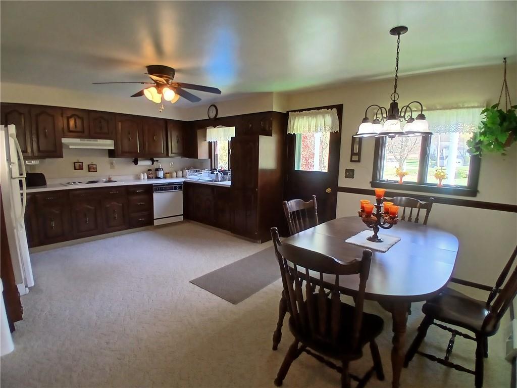 186 Dutch Hill Road Latrobe, PA 15650 - Photo 6 of 29 a kitchen with kitchen island a dining table and chairs