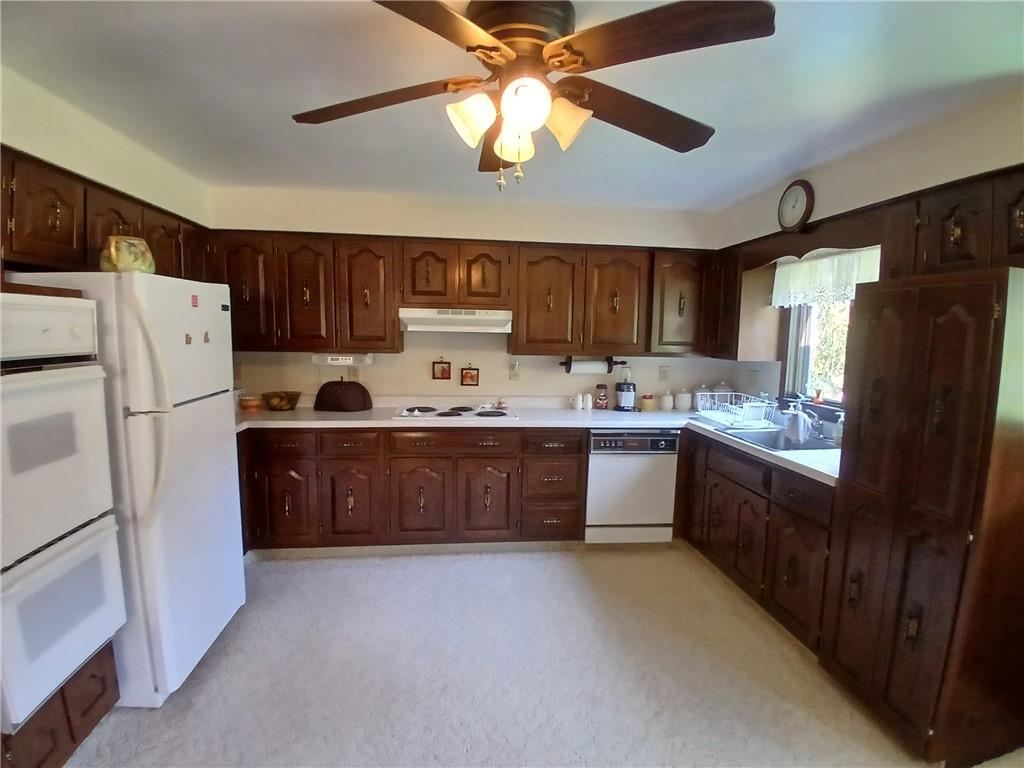 186 Dutch Hill Road Latrobe, PA 15650 - Photo 7 of 29 a kitchen with stainless steel appliances a refrigerator a sink a stove a refrigerator and island