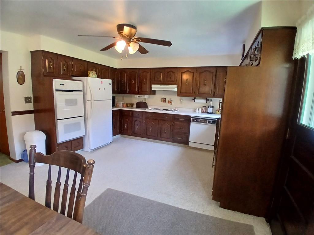 186 Dutch Hill Road Latrobe, PA 15650 - Photo 8 of 29 a kitchen with refrigerator and cabinets