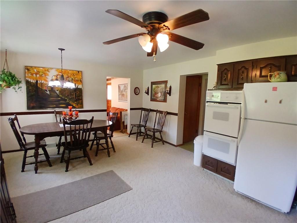 186 Dutch Hill Road Latrobe, PA 15650 - Photo 10 of 29 a view of a dining room with furniture and a kitchen