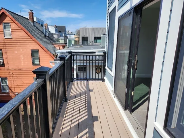 a view of balcony with wooden floor