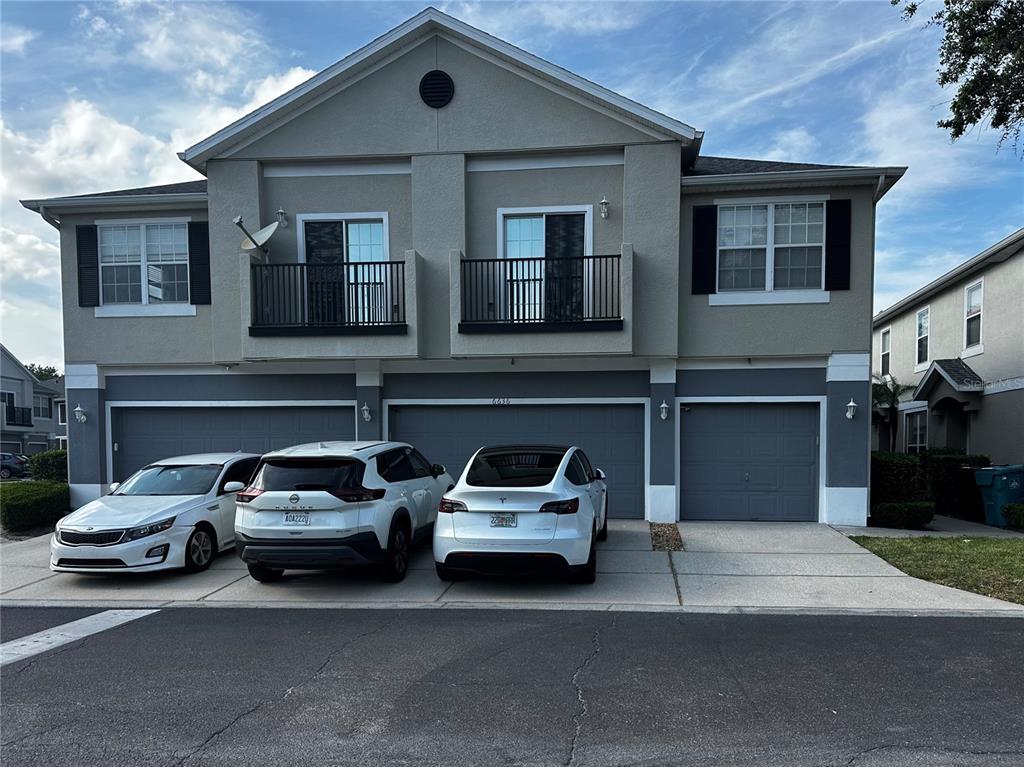 6636 South Goldenrod Road, Unit 116B Orlando, FL 32822 - Photo 1 of 1 a car parked in front of a house