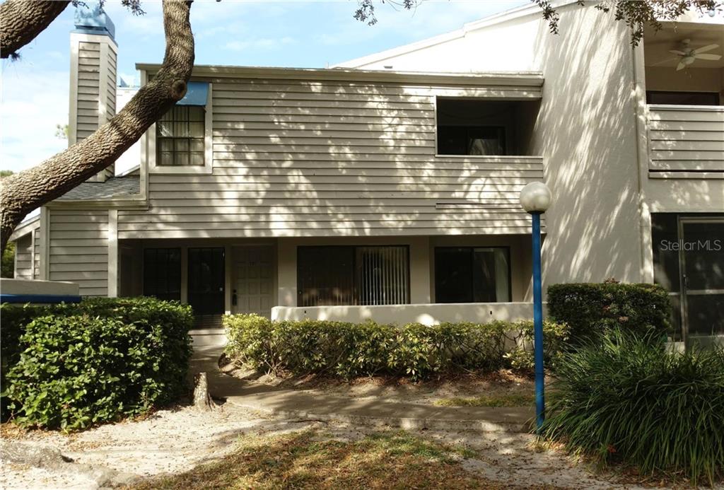 8737 Bardmoor Place, Unit 101 Seminole, FL 33777 - Photo 1 of 1 Entry has patio space across the front with a storage closet.