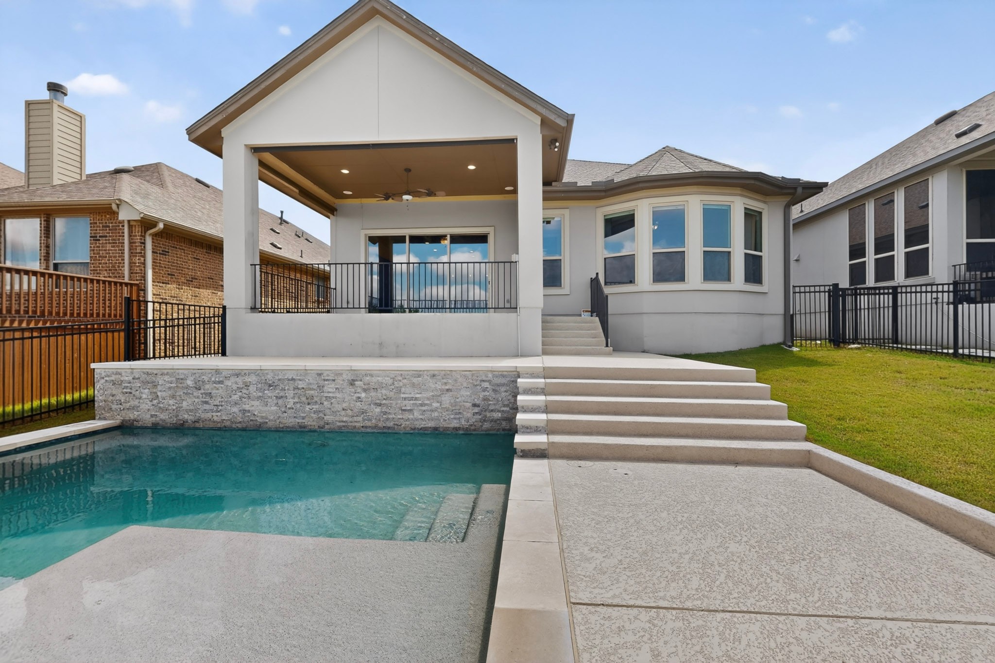 2617 Milan Meadows Drive Leander, TX 78641 - Photo 34 of 40 Entertain al fresco on the covered patio overlooking a refreshing private pool.