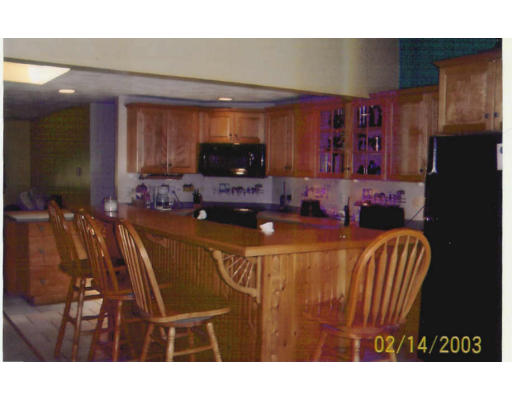 132 Lexington Road Billerica, MA 01821 - Photo 7 of 15 a living room with stainless steel appliances kitchen island granite countertop furniture and a view of kitchen