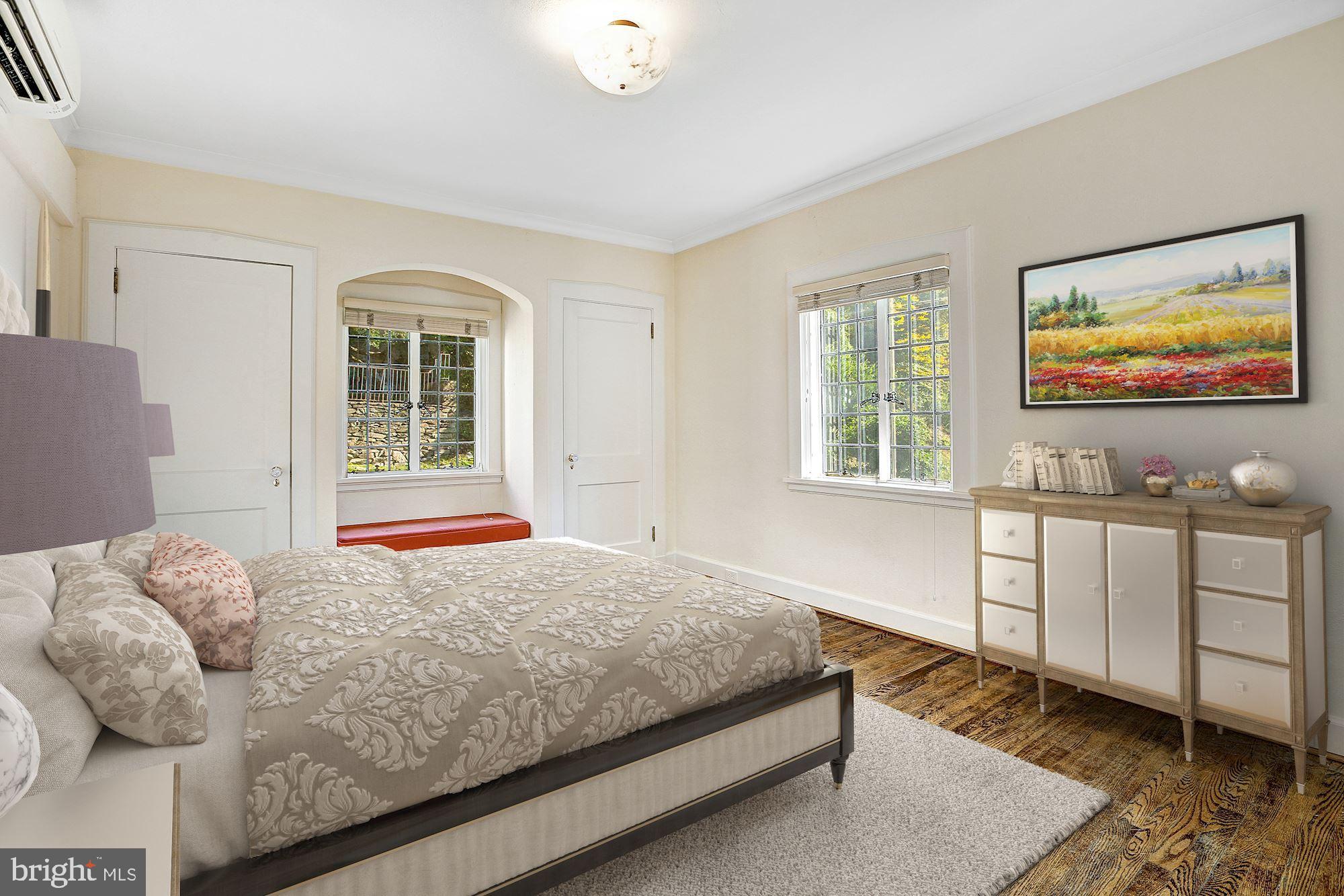 2701 32nd Street Northwest Washington, DC 20008 - Photo 11 of 17 a bedroom with a bed and window