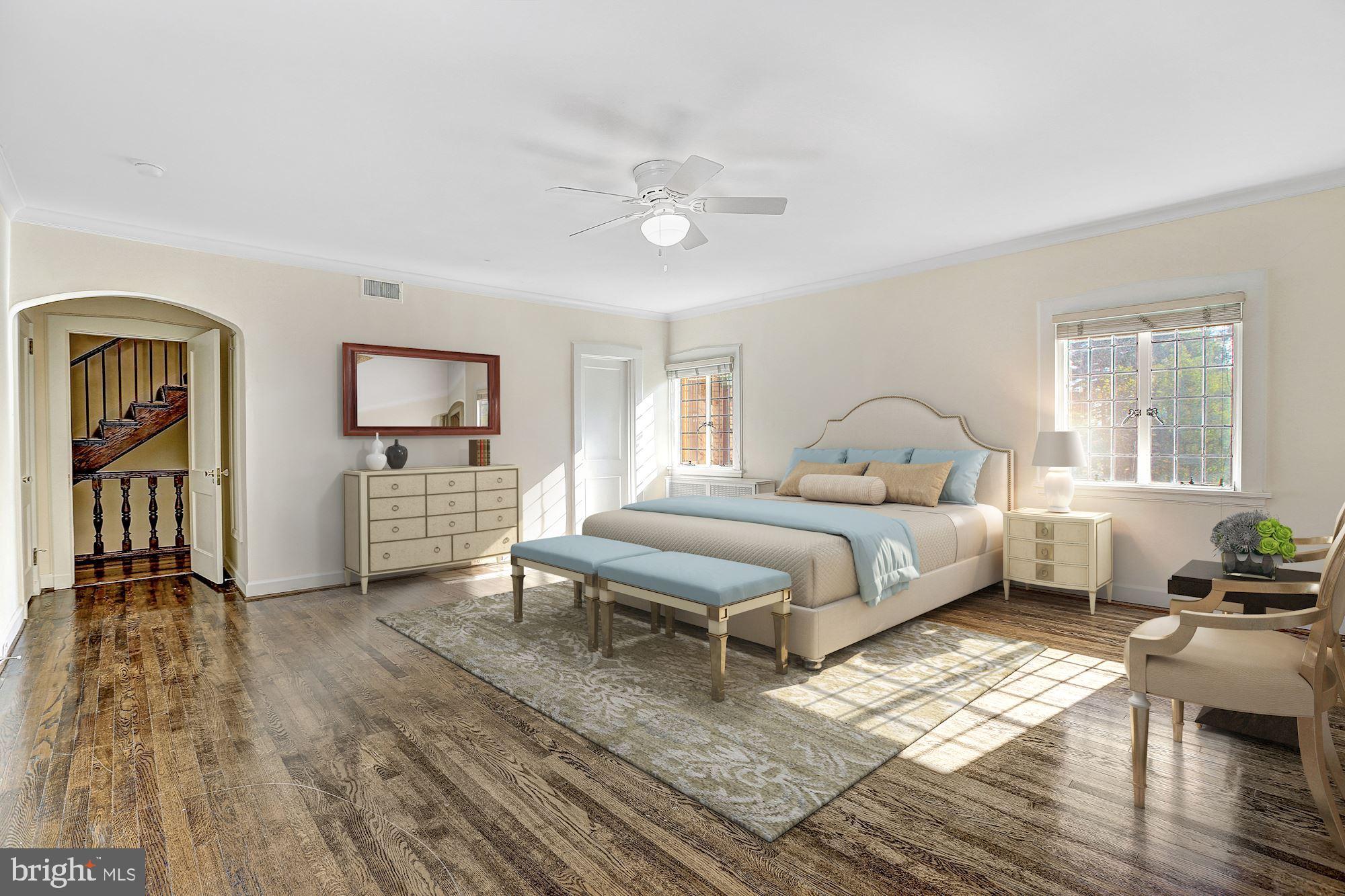 2701 32nd Street Northwest Washington, DC 20008 - Photo 10 of 17 a bedroom with a bed and a chandelier