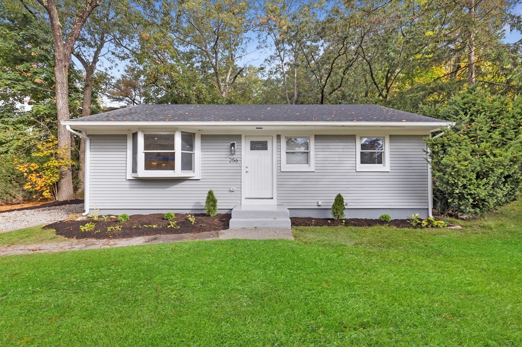 256 Great Road Maynard, MA 01754 - Photo 1 of 26 a backyard of a house with table and chairs