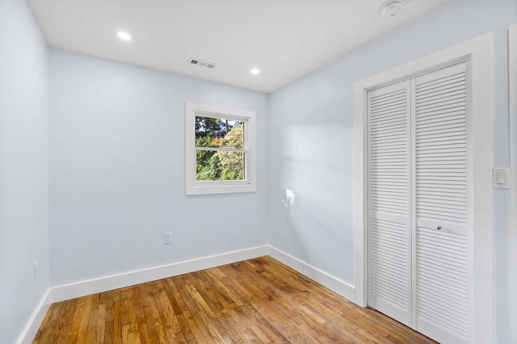 256 Great Road Maynard, MA 01754 - Photo 19 of 26 a view of room with window and wooden floor