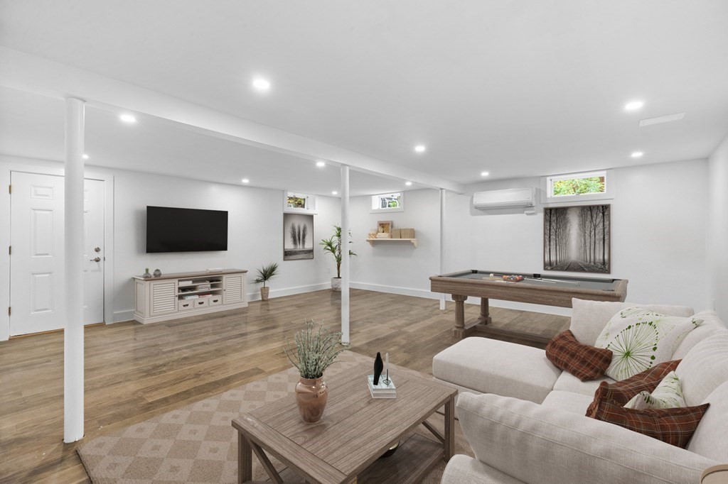 256 Great Road Maynard, MA 01754 - Photo 22 of 26 a living room with furniture and a flat screen tv